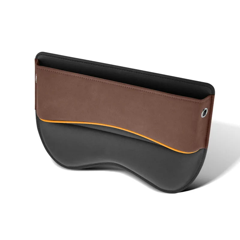 Black leather car seat storage box on a vehicle seat showing its rectangular shape and size.