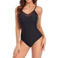 Ladies black mesh one-piece swimsuit with backless design on mannequin