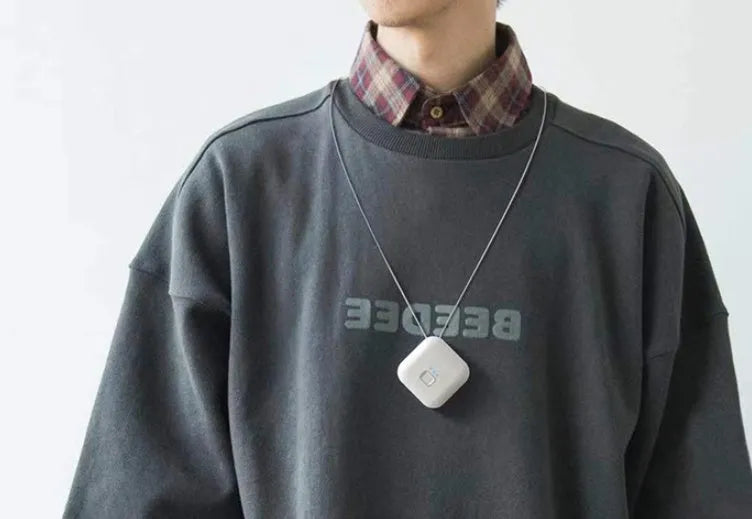 Mini USB portable air purifier necklace in collar design shown in blue, grey, pink and white colours.