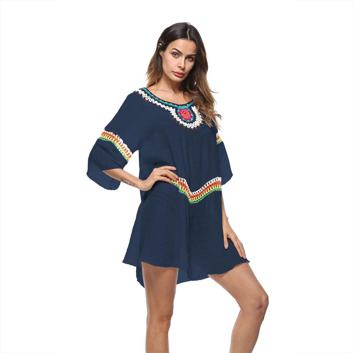 Crocheted white ethnic-style beach cover-up for women, shown as sun protection clothing.