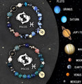 Two natural stone beaded bracelets with zodiac sign charms on a wrist