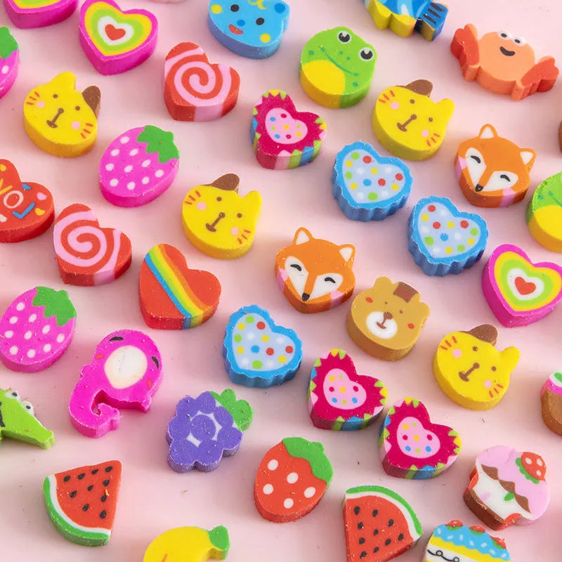Assortment of fifty small cartoon-shaped rubber erasers in fruit and animal designs.