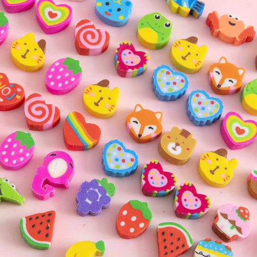 Assortment of fifty small cartoon-shaped rubber erasers in fruit and animal designs.