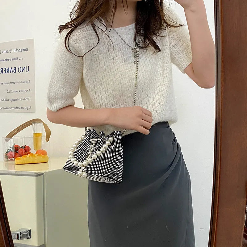 Western-style diamond shoulder bag with chain crossbody strap in bucket shape