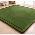 Thick coral velvet non-slip tatami mat in olive green, hand woven finish, placed on wooden floor