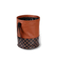 Retractable leather interior car trash can with handle shown in vehicle