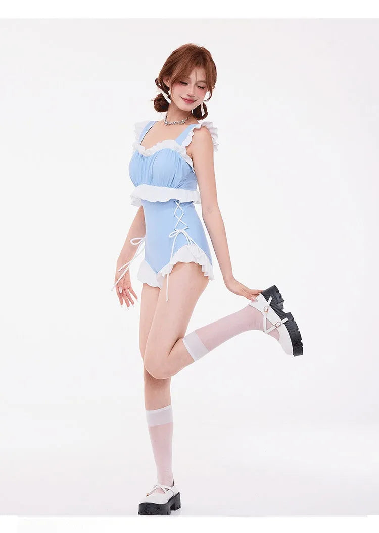 Light blue high-waisted women's one-piece swimsuit with lace detailing and a backless design.