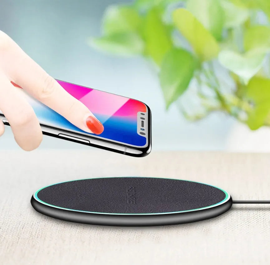 Black Qi wireless charging pad for iPhone 11 with USB cable