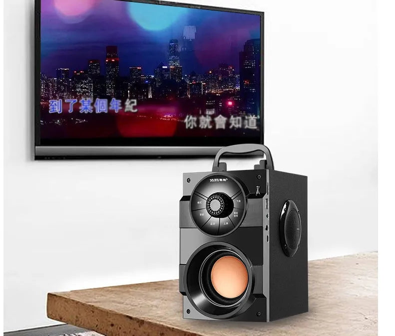 Black portable mini audio system with subwoofer, USB power cable and 3.5mm audio connection