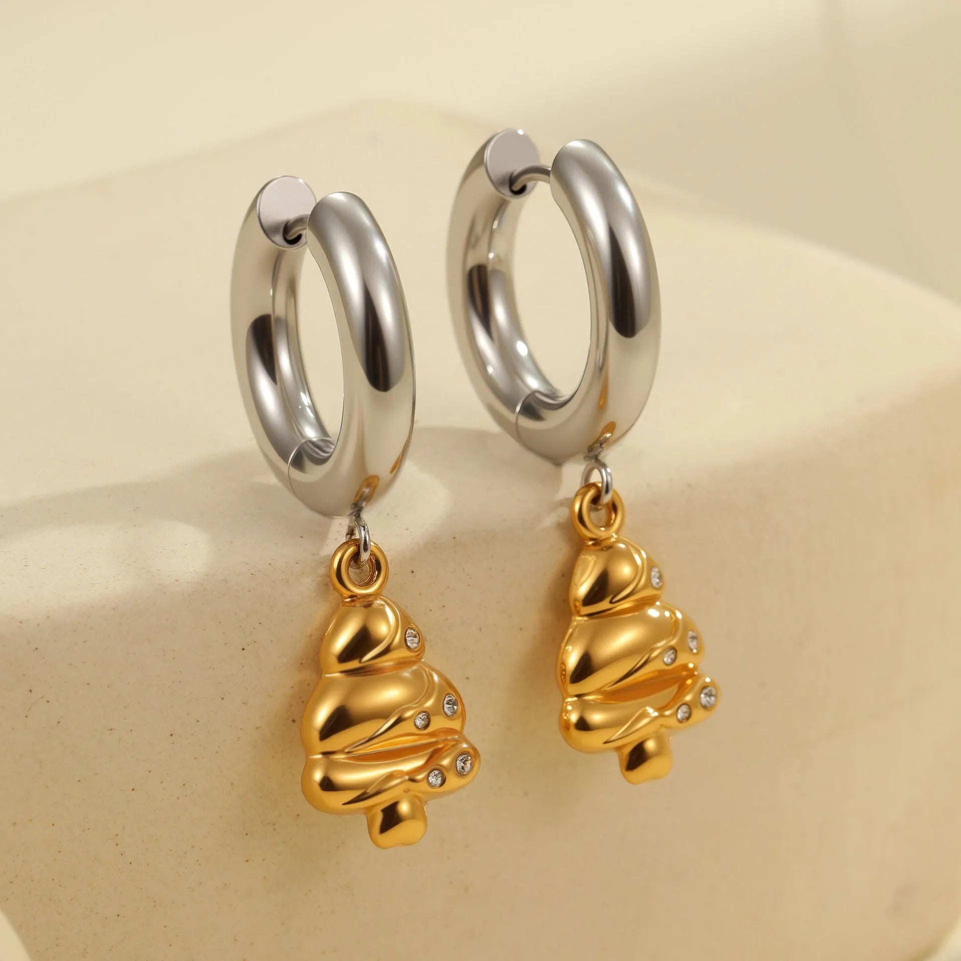 Christmas tree shaped stainless steel earrings with 18K gold electroplated finish and heart star geometric accents