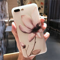 Embossed floral design on a black TPU iPhone case for iPhone 11.