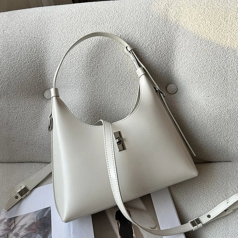 Genuine leather dumpling-shaped crossbody bag in apricot colour with shoulder strap