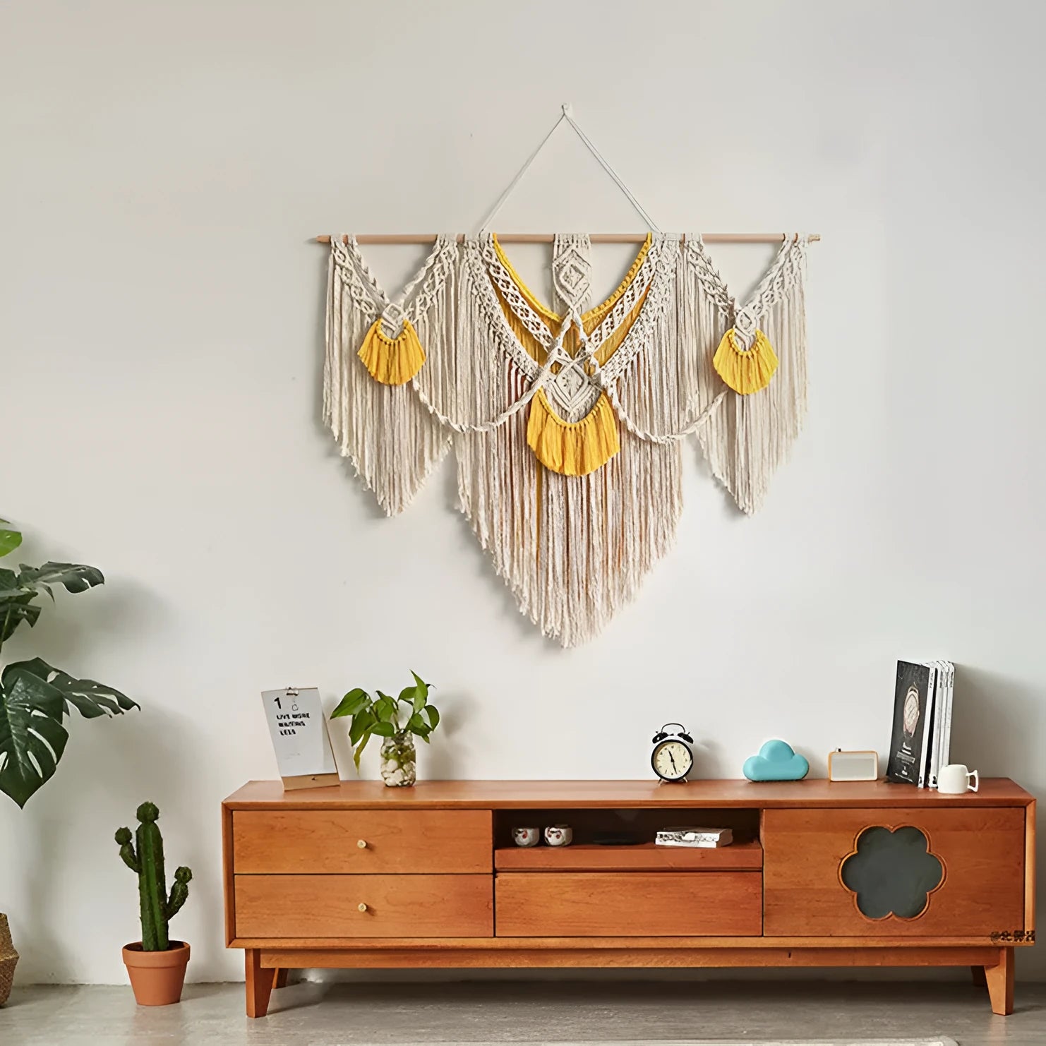 Rectangular creamy white cotton tapestry with colour woven details measuring 120cm by 95cm