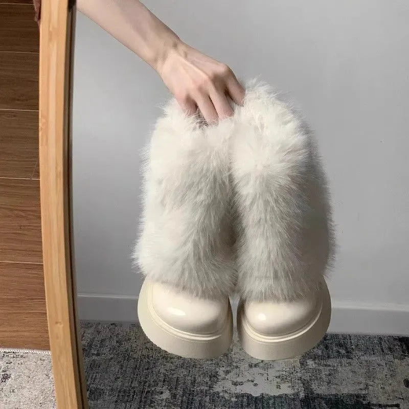 Women's black fleece-lined low-top snow boots with a round toe, waterproof platform, and a mid-height heel on a rubber sole.