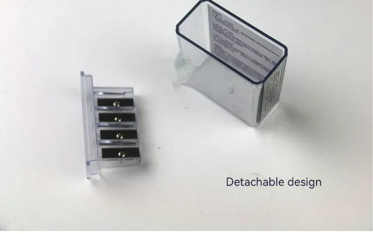 Geometric-shaped plastic pencil sharpener with four holes and a small screwdriver.