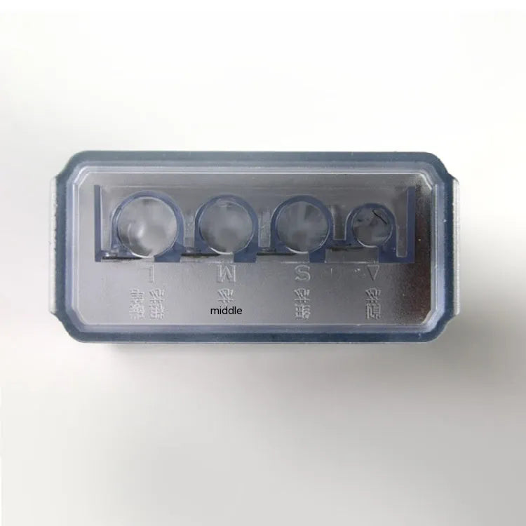 Geometric-shaped plastic pencil sharpener with four holes and a small screwdriver.