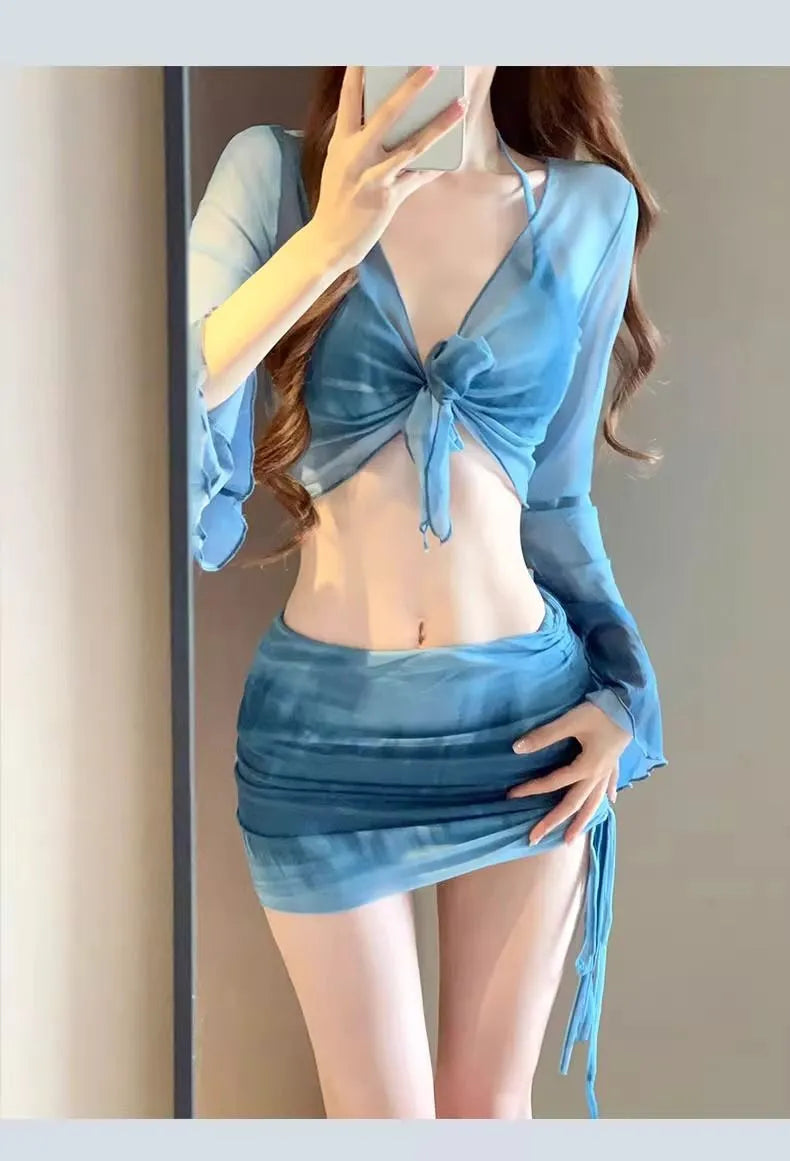 Blue high-waisted women's bikini four-piece set showing shirt, bra, underwear, and skirt.