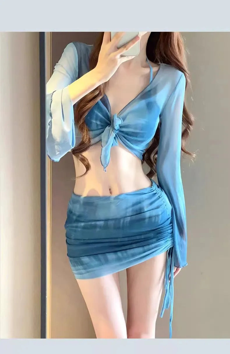 Blue high-waisted women's bikini four-piece set showing shirt, bra, underwear, and skirt.