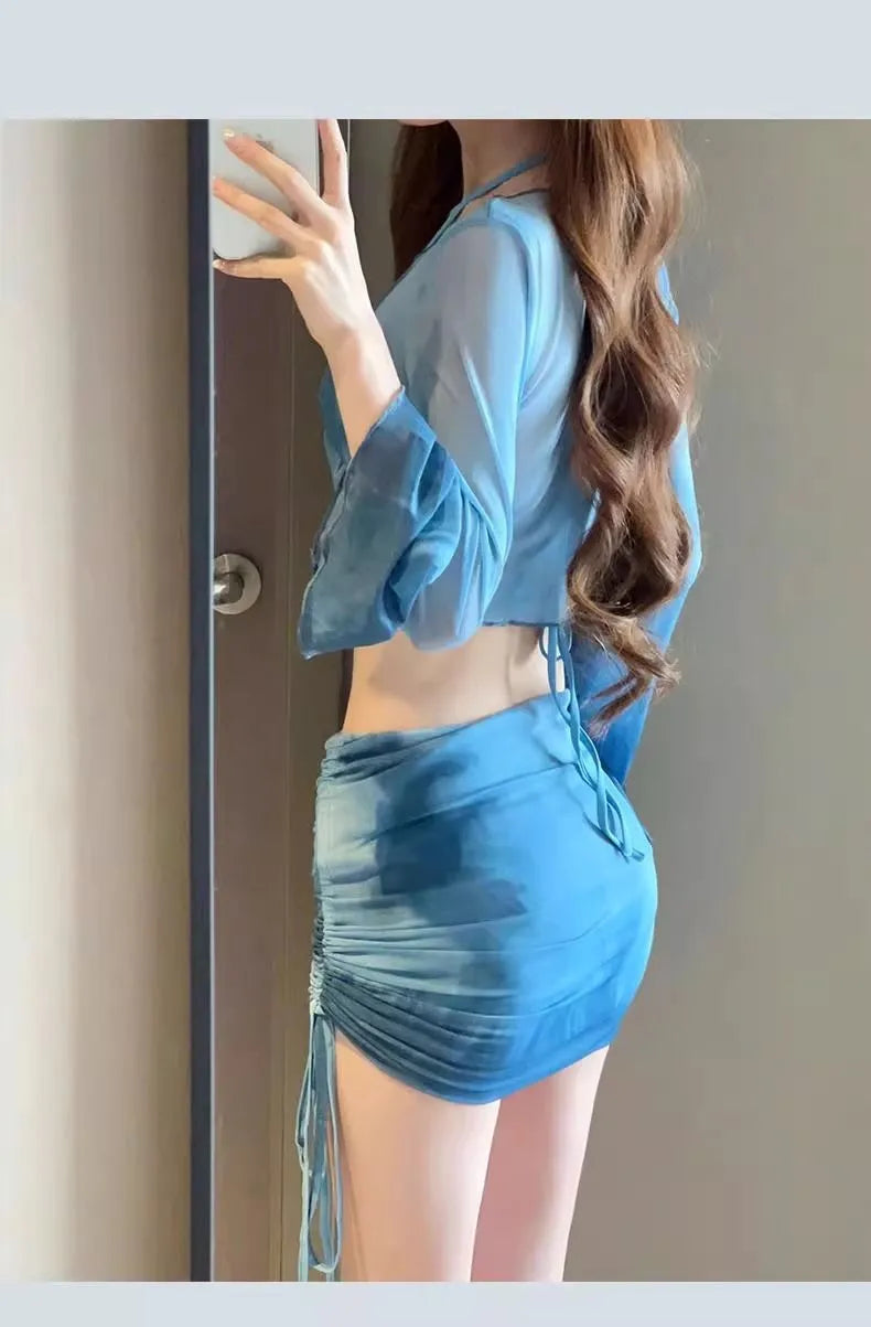 Blue high-waisted women's bikini four-piece set showing shirt, bra, underwear, and skirt.