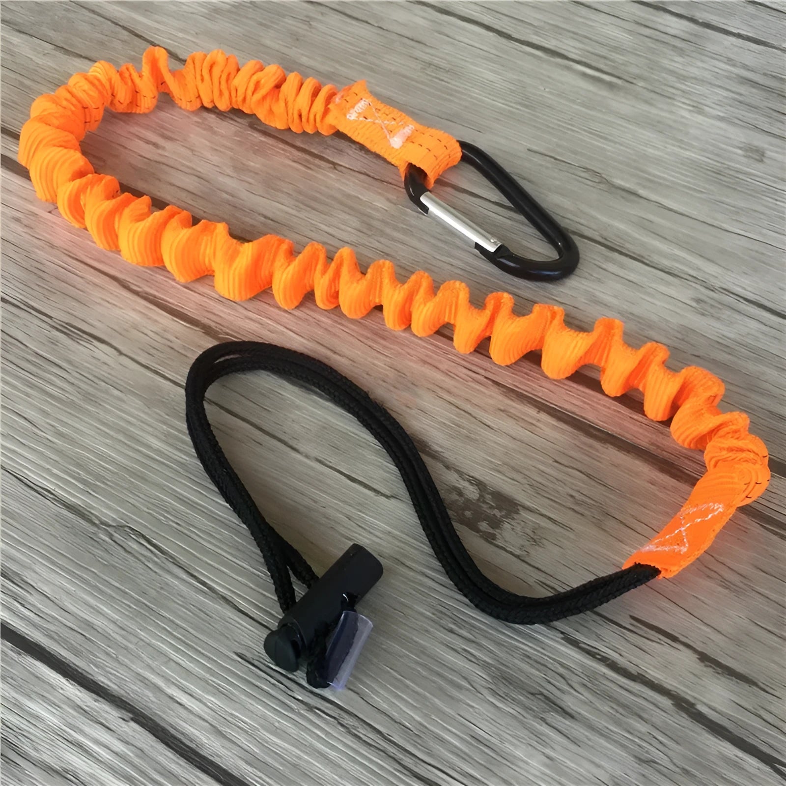 Orange fishing rod safety rope with 90cm length shown next to fishing rod