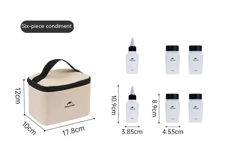Set of six white portable seasoning bottles with black lids for outdoor picnics and camping.