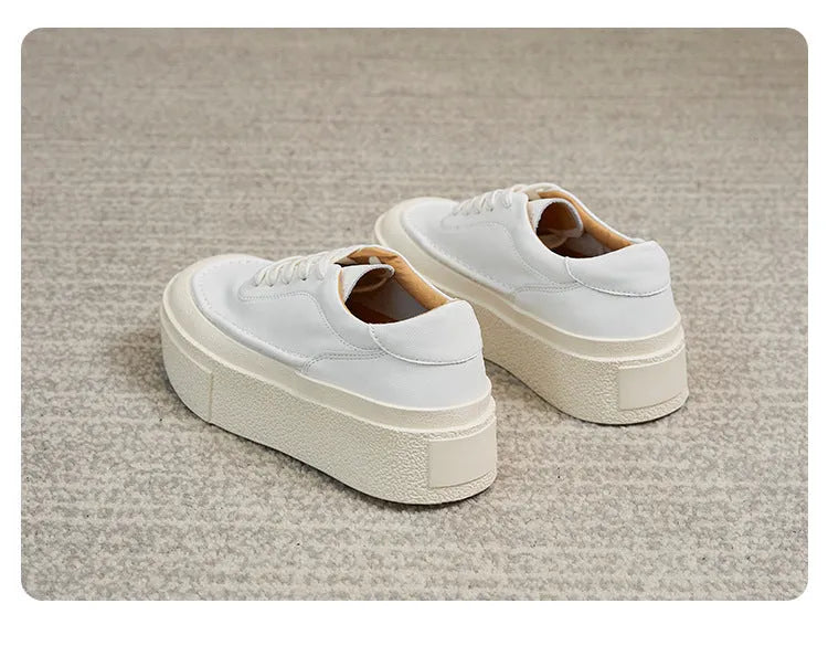 Women's black platform sports shoes with embossed cowhide leather upper and rubber sole