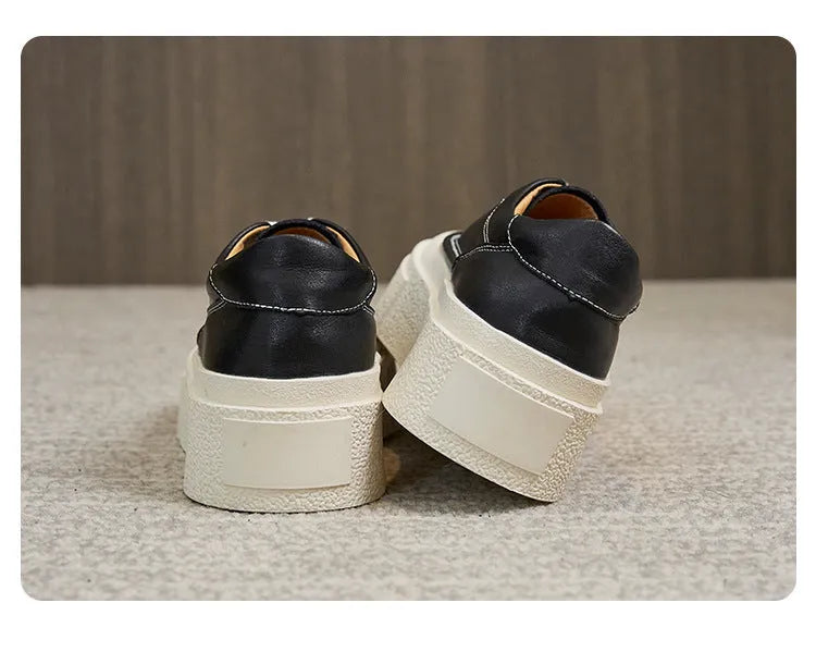 Women's black platform sports shoes with embossed cowhide leather upper and rubber sole