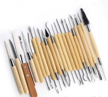 Brown 27-piece pottery tool set with storage roll, containing wood, stainless steel, and plastic clay modelling tools.