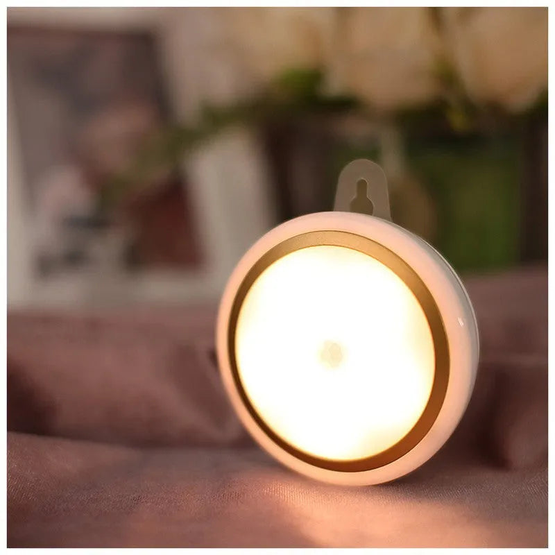 Circular white motion sensor LED light unit showing five LEDs, 80mm in diameter.