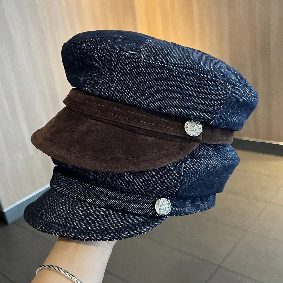 Dark blue denim octagonal newsboy hat with adjustable band and colour trim brim options