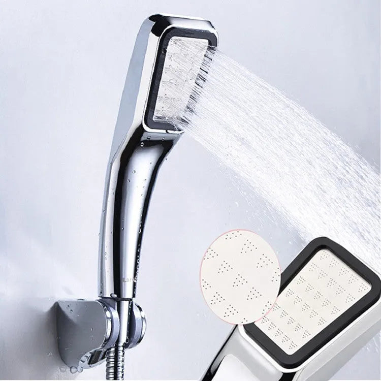 Orange hand-held pressurised shower head with rain function, part of a complete shower set