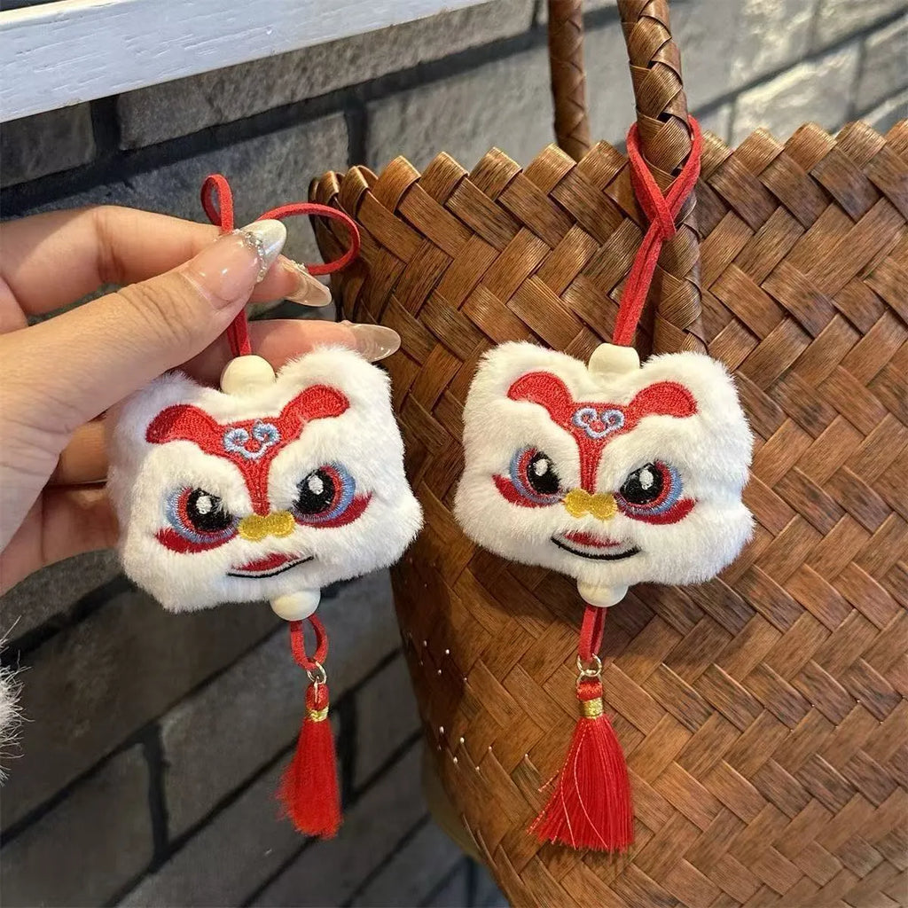 Chinese style blue and yellow plush lion keychain ornament with star stone detail and tassel