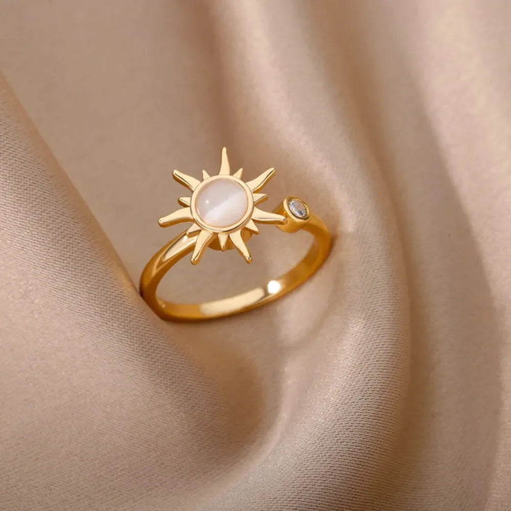 Simple open mouth adjustable copper ring in gold colour on a grey background