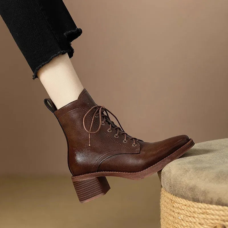 Women's black pointed-toe short tube boots with 5.5cm heel and velvet detailing on artificial PU upper