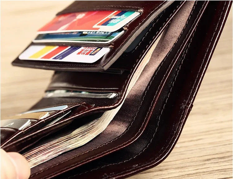 Men's leather wallet showing multiple internal compartments for cards, cash, coins and photos