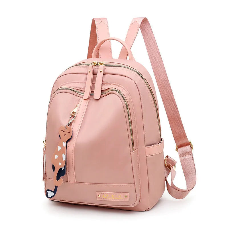 Women's black nylon backpack with square vertical shape showing internal compartments and shoulder straps
