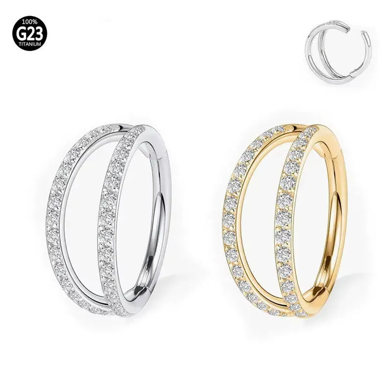Close-up of a G23 titanium alloy nose or ear ring with a small zircon gemstone, shown in a gold tone finish.