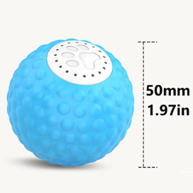 Remote control and colourful plastic rolling ball cat toy with sound on a wooden floor.