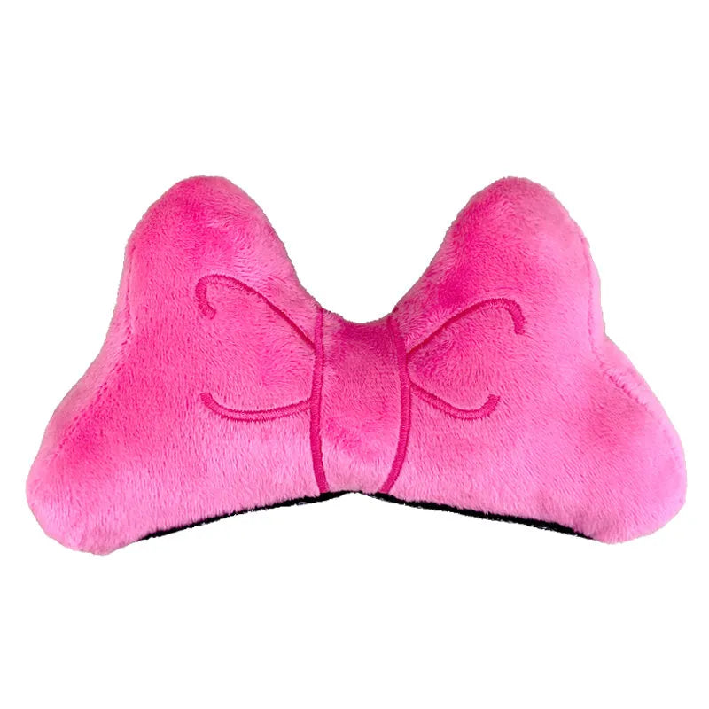 Soft plush bow helmet decoration for motorcycle and ski helmets in red or pink colours.