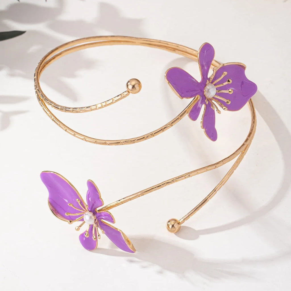 Alloy hollow armband bracelet with pattern lines shown in pink and purple colour options