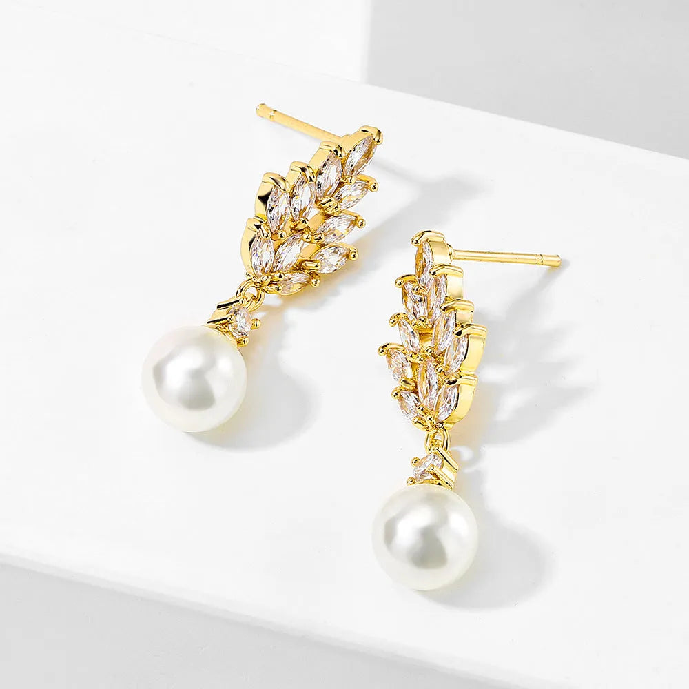 Geometric flower design pearl earrings with micro inlaid zircon stones in gold, platinum, or rose gold plated finishes.