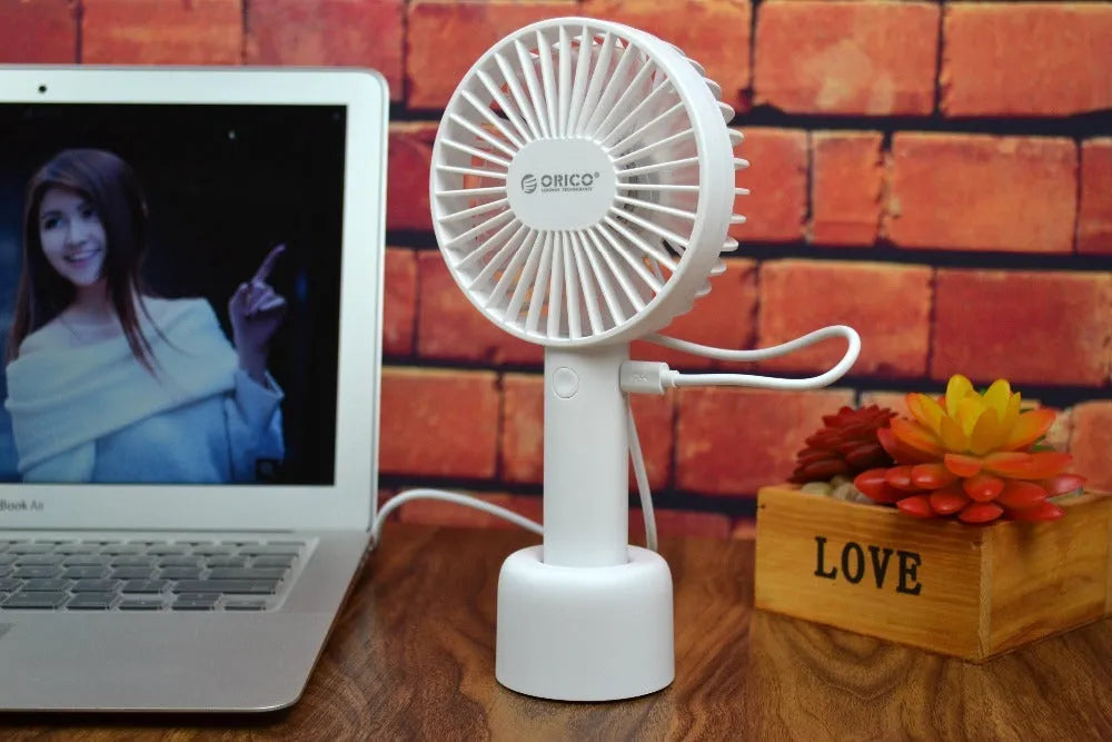 ORICO FH1 white portable USB rechargeable fan with adjustable speed settings and handheld design