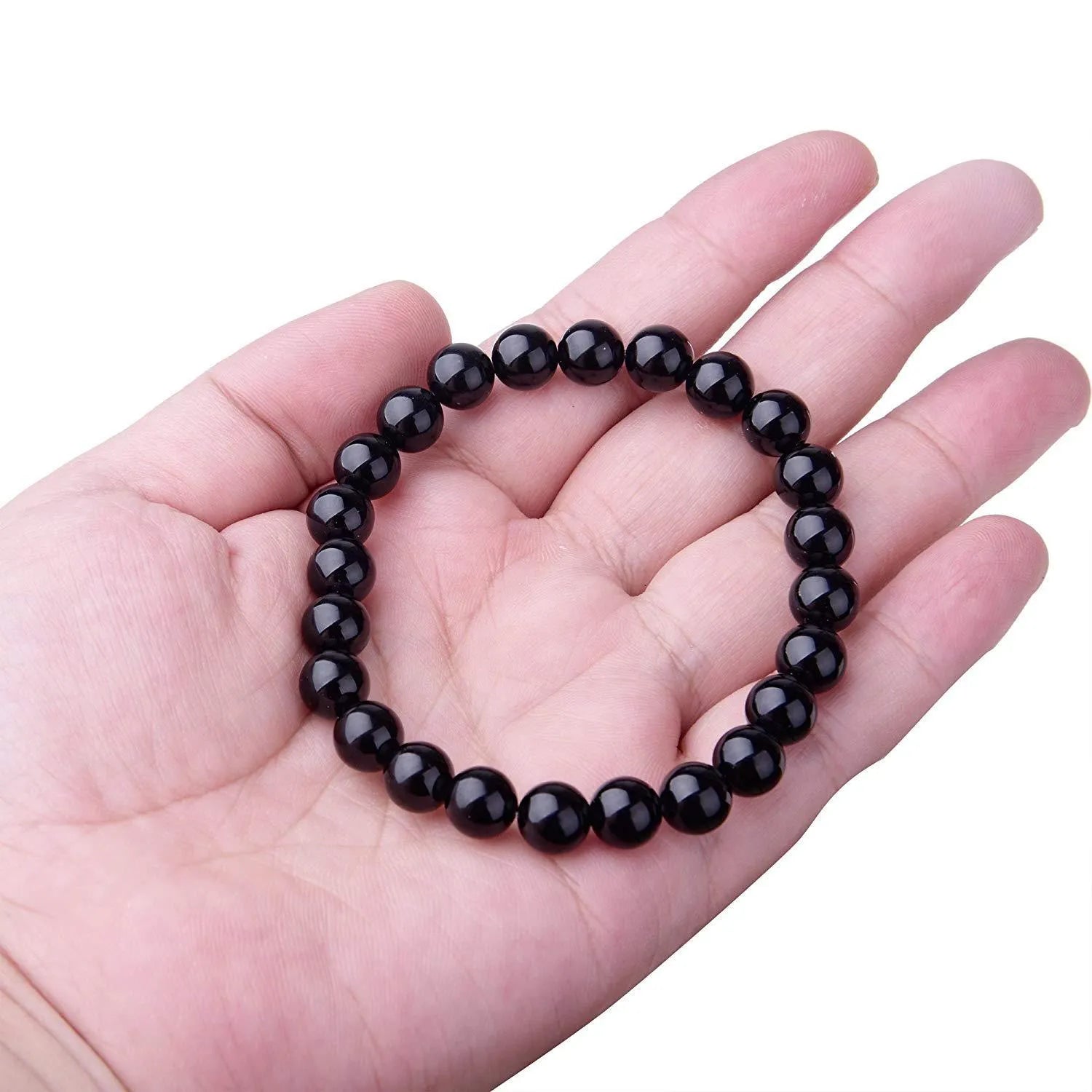 Geometric black agate beaded bracelet with 8mm stones on a black elastic cord.