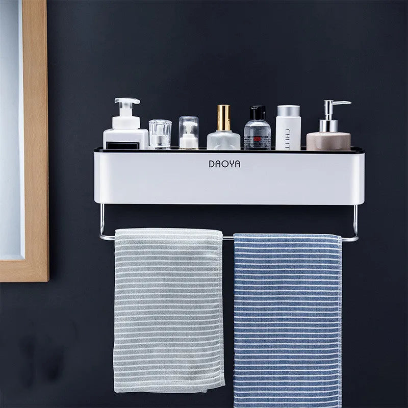 Adhesive plastic wall-mounted bathroom shelf in black or grey, holding shampoo and shower gel bottles.