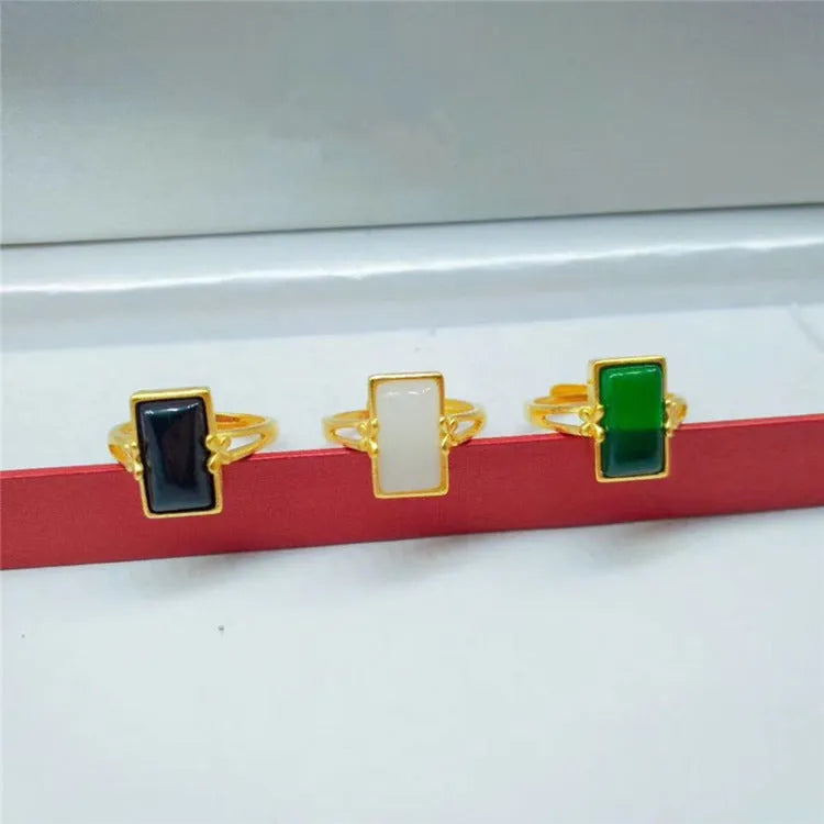 Brass gold-plated adjustable ring with long artificial gemstone in green, white, or black colour option