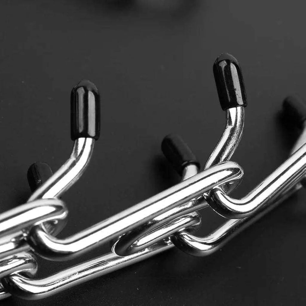 Stainless steel dog prong training collar with rubber tips, shown in an adjustable chain link design.