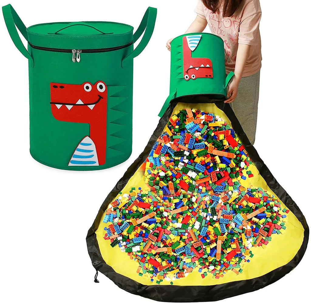 Green felt cube storage bag with pull rope open as a floor play mat for toys.