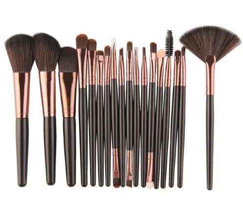 MAANGE 18 piece makeup and brush set with fan-shaped brushes and multiple style options laid out.