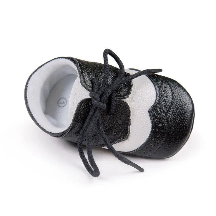 Vintage style baby walking shoes with soft soles and synthetic leather uppers in multiple colours
