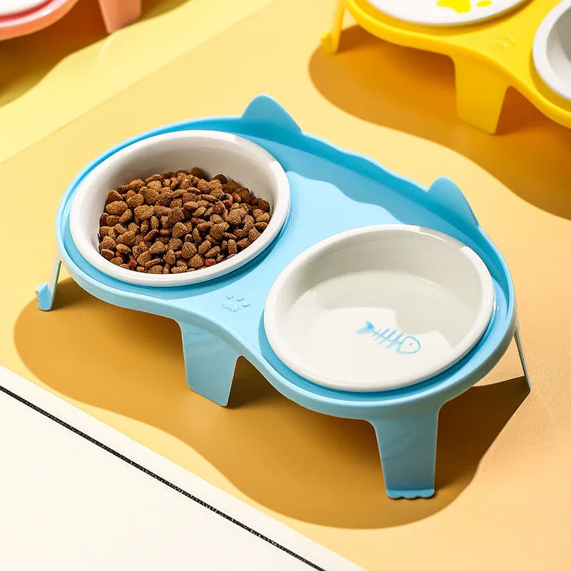 Ceramic cat food and water bowl set on tilted elevated stand in blue, pink, white or yellow colours